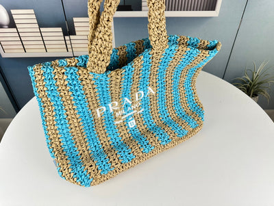 PRA* 24SS Hollow Woven Raffia Shopping Bag